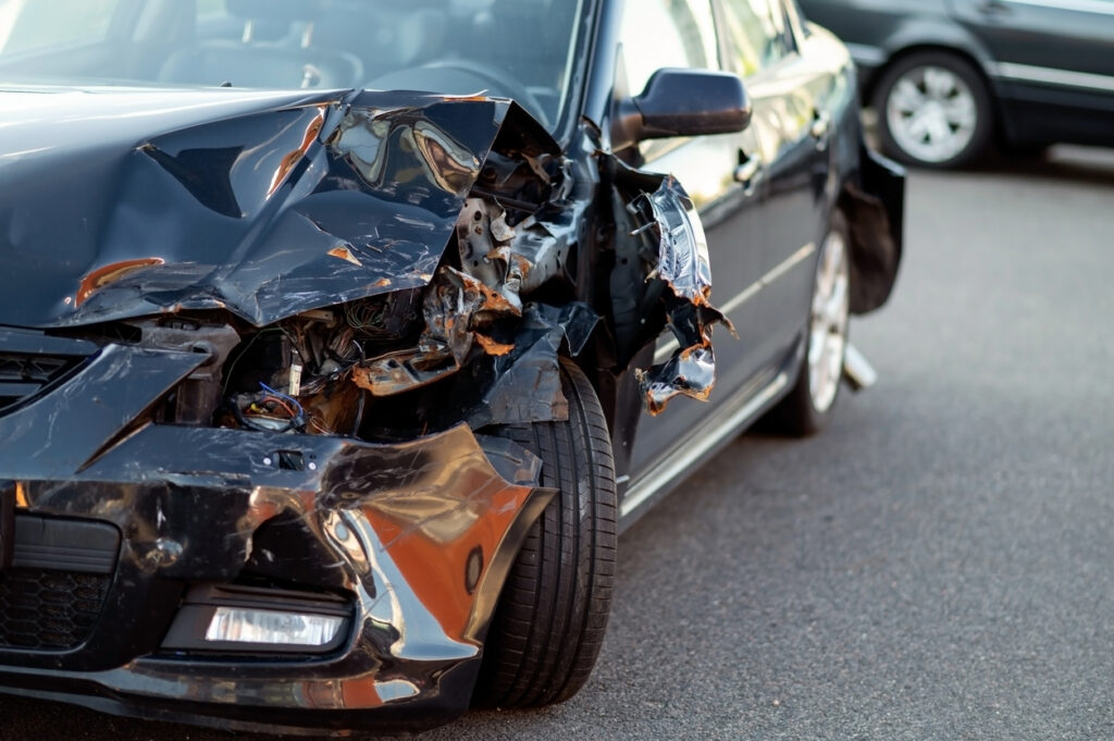 Close-up of damaged car part after accident