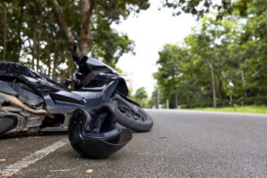 Motorcycle accident with helmet on road